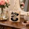 Pretty lady wearing a large feathered hat on a 4 x 4 inch wooden desk sitter with natural pine sides.